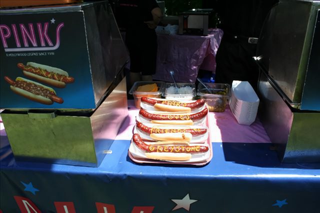 A table with several hot dogs on it.