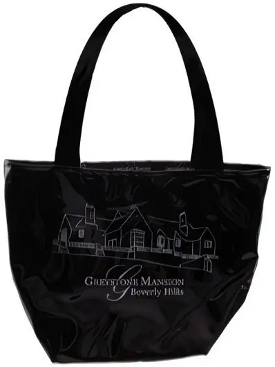 A black bag with a picture of houses on it.