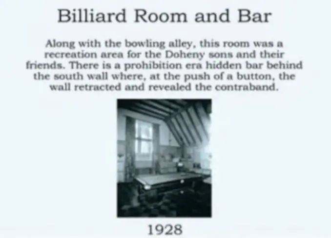 A room with a bar and billiard table in it.