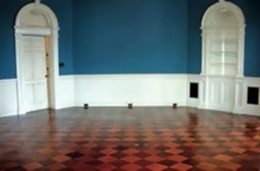 A room with blue walls and checkered floor.